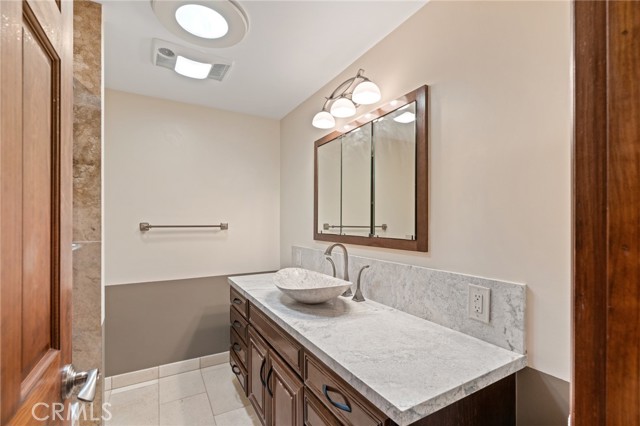 The 3rd bathroom is upstairs with remodeled bathtub and shower.