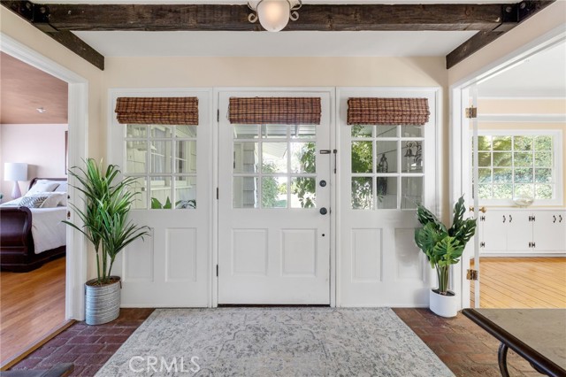 Formal entry with beamed ceiling - a perfect way to welcome guests.