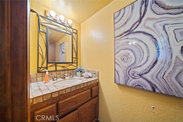 Powder room on 1st level next to family room