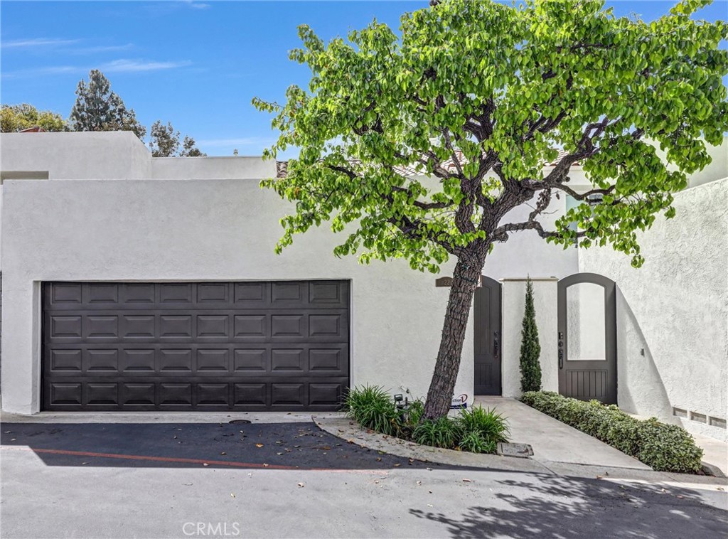 Welcome to 22 Crest Circle a stunning home nestled in the heart of Corona del Mar. This beautifully designed residence offers 1,709 square feet of refined living space, featuring two spacious primary bedrooms and two and a half bathrooms. The moment you step through the private courtyard entrance, you are greeted by elegant architectural elements that add a touch of sophistication throughout.

The open-concept living area boasts gleaming hardwood floors and a beautiful fireplace, creating a warm and inviting atmosphere perfect for relaxation or entertaining. The thoughtfully designed layout ensures seamless flow from room to room, enhancing the magnificent natural lighting.

The kitchen is a chef's dream, featuring new wood custom cabinets with pullouts, new Brazilian deep blue granite countertops ideal for culinary creations and gatherings with loved ones. You will love the updated Dual Primary Suites with marble walls and frameless glass showers. The oversized attached 2 car garage with new epoxy flooring provides convenient parking and additional custom storage cabinets.

The back patio is large and private with a covered deck from the primary balcony and maintenance free turf that are great for enjoying the sunshine.

Residents in the prestigious Canyon Crest Estates enjoy resort living at its finest. The sparkling pool, spa, and tennis court are perfect for leisurely afternoons under the California sun, followed by an evening walk to the beach to enjoy gorgeous sunsets.

Situated in an enviable location, this home offers the perfect blend of luxury and comfort, surrounded by the vibrant lifestyle and amenities that Corona del Mar has to offer. Don't miss the opportunity to make 22 Crest Cir your new home. Schedule a viewing today and discover the unparalleled charm and elegance that await you.