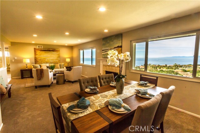 Dining and living room with views and cozy fireplace!