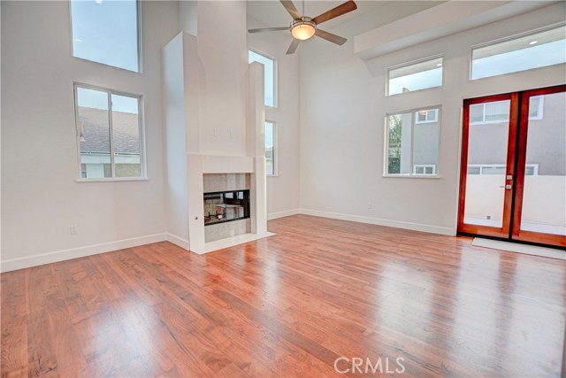 LIVING ROOM FIREPLACE FRENCH DOORS TO BALCONY