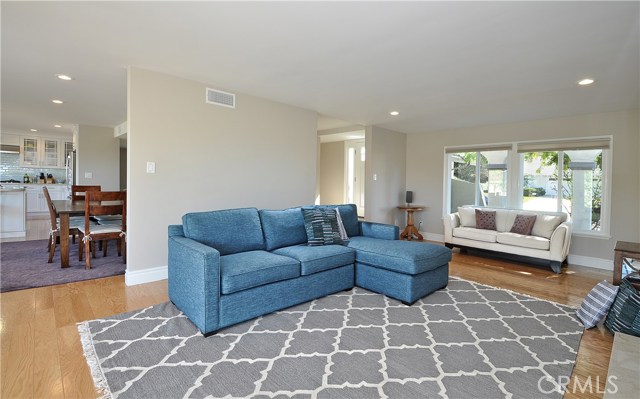 Living room looking into dining room and kitchen