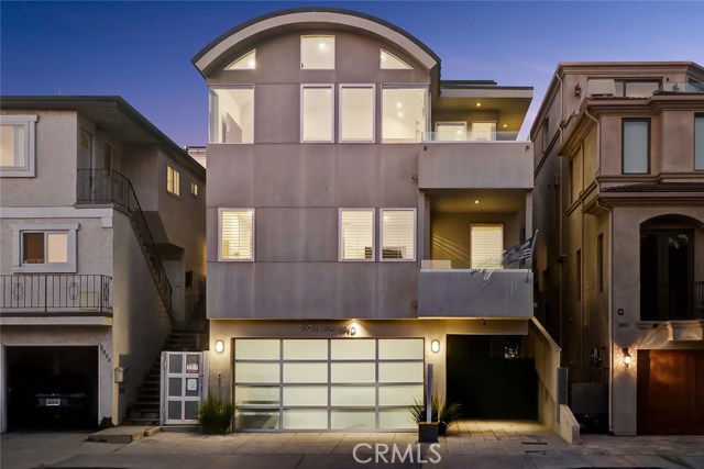 2804 Highland Avenue Manhattan Beach, California Ideally situated on a high point between Downtown and the North End, this location offers outstanding panoramic views stretching from PV to Malibu! Enjoy views of whitewater, Bruce’s Beach and all three piers! The open concept upper living areas are emphasized by high, domed ceilings and a floor-to-ceiling fireplace adorned with imported Italian tile. A sleek, contemporary ocean view kitchen features premium Miele and Wolf appliances, clever pull out shelving, over-head appliance garages, a built-in dry bar area, and a step-in pantry that centers around a double waterfall edge, porcelain topped center island. A Ring doorbell, Sonos sound, security cameras, alarm and thermostat are all tied to a Vivint automation system. 3-stop elevator and water purifier/softener system. Skylights, motorized sun shades, A/C and ceiling fans control the home’s environment. A large primary bedroom suite has an ocean peek deck. His and hers walk-in closets sit between a dressing mirror. The spa-styled bath features high counters, soaking tub, and walk-in shower. 2nd bedroom + full bath are on same level. Full guest suite on lower level. 4th bedroom with great built-ins on upper level. Stackable laundry area. Highly coveted parking for up to 7 vehicles - rare this close to the beach and a must-have for those who love to entertain! Turf-lined side and back areas are perfect for small dogs. An ideal location for the true beach lover! Copy link to browser for 3D Tour: https://bit.ly/30Lm8U5