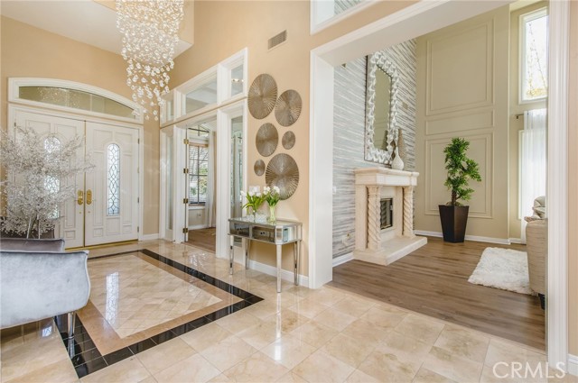 The 6 foot crystal chandelier greats you as you enter the home. The 6 foot crystal chandelier greats you as you enter the home.