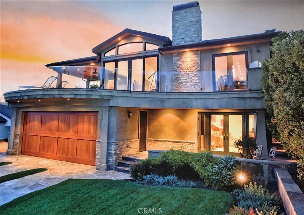 North Laguna Oasis with Panoramic Ocean Views. Welcome to 535 High Dr. this coastal luxury home perched to capture stunning ocean views and nestled in lush garden spaces perfect for entertaining in serene privacy is located in one of Laguna's most coveted neighborhoods. This home offers a rare blend of privacy, natural beauty and refined living. Enter the large gated stone courtyard from the Hawthorne side of the property to the sound of the trickling water feature and lush garden spaces step inside to discover the harmonius fusion of contemporary elegance and coastal sophistication. With soaring ceilings, fireplace, Brazilian cherry wood floors and sun drenched interiors, the open concept great room flows effortlessly onto an expansive deck ideal for entertaining or basking in the ocean breeze. It also features a chef-caliber kitchen with custom cabinetry, stone counter tops, center island complimented by a glass-art shelf for entertaining, state of the art appliances, new Thermador double ovens and cooktop, two Bosch dishwashers, wine refrigerator and reverse osmosis water filter. The home features three ensuite bedrooms, including two spacious primary suites. One on the main level that opens to the large deck features a walk in closet, spa shower and heated bath tub. The second primary on the lower level is complete with it's own fireplace and opens to the lower stone patio with a fire pit and fountain. The spa-inspired baths finished with the finest of materials are designed for comfort and privacy to elevate everyday living to a luxurious retreat. The lot is totally enclosed with a private gate that enters the driveway from the alley to the oversized two car garage with built-in storage, air conditioning and a Tesla charger. The driveway can be used as part of the lower patio for entertaining in total privacy. Located just moments from iconic beaches, Heisler Park, Riddle field and close to town, shopping and world-renowned festivals, this is more than a home-it's a lifestyle. North Laguna Oasis with Panoramic Ocean Views. Welcome to 535 High Dr. this coastal luxury home perched to capture stunning ocean views and nestled in lush garden spaces perfect for entertaining in serene privacy is located in one of Laguna's most coveted neighborhoods. This home offers a rare blend of privacy, natural beauty and refined living. Enter the large gated stone courtyard from the Hawthorne side of the property to the sound of the trickling water feature and lush garden spaces step inside to discover the harmonius fusion of contemporary elegance and coastal sophistication. With soaring ceilings, fireplace, Brazilian cherry wood floors and sun drenched interiors, the open concept great room flows effortlessly onto an expansive deck ideal for entertaining or basking in the ocean breeze. It also features a chef-caliber kitchen with custom cabinetry, stone counter tops, center island complimented by a glass-art shelf for entertaining, state of the art appliances, new Thermador double ovens and cooktop, two Bosch dishwashers, wine refrigerator and reverse osmosis water filter. The home features three ensuite bedrooms, including two spacious primary suites. One on the main level that opens to the large deck features a walk in closet, spa shower and heated bath tub. The second primary on the lower level is complete with it's own fireplace and opens to the lower stone patio with a fire pit and fountain. The spa-inspired baths finished with the finest of materials are designed for comfort and privacy to elevate everyday living to a luxurious retreat. The lot is totally enclosed with a private gate that enters the driveway from the alley to the oversized two car garage with built-in storage, air conditioning and a Tesla charger. The driveway can be used as part of the lower patio for entertaining in total privacy. Located just moments from iconic beaches, Heisler Park, Riddle field and close to town, shopping and world-renowned festivals, this is more than a home-it's a lifestyle.