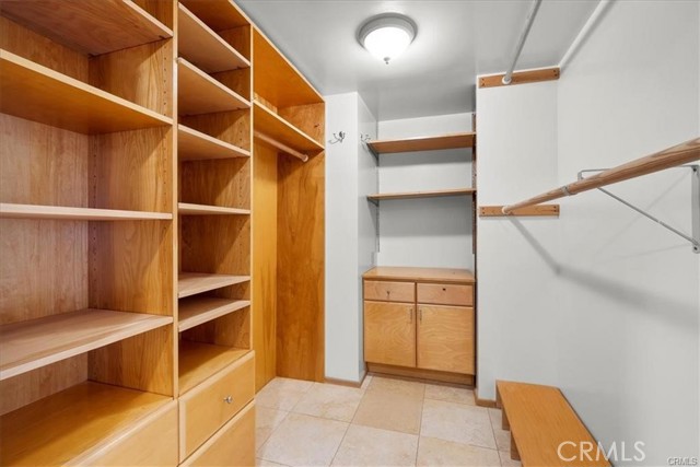 Primary bedroom walk-in closet