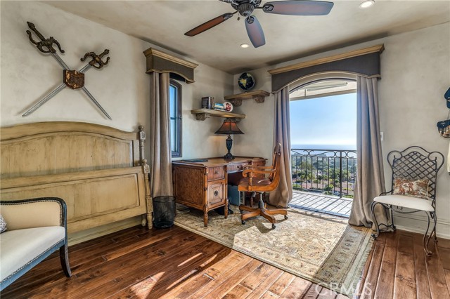 Upstairs bedroom enjoys ocean views and balcony.