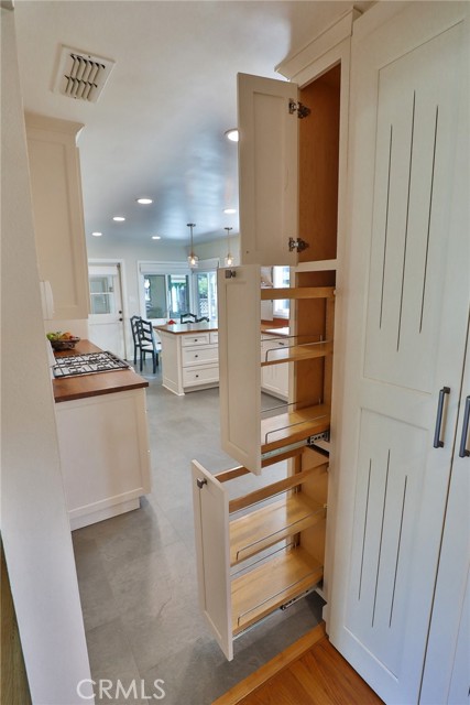 The hall beyond the kitchen gives even more space!