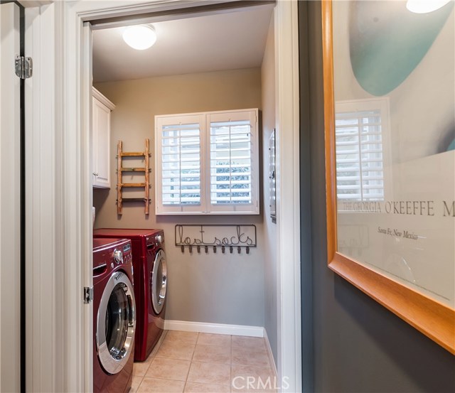 Separate downstairs laundry room with pocket door