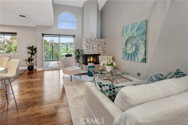 Living room fireplace and patio with beautiful view