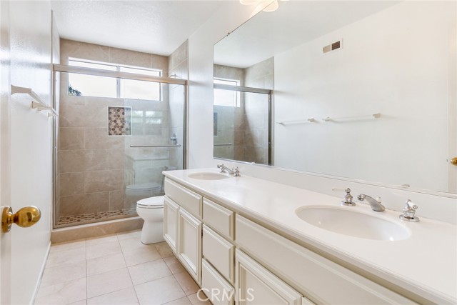 Upstairs Hallway Bathroom with Dual Sinks and Remodeled Shower