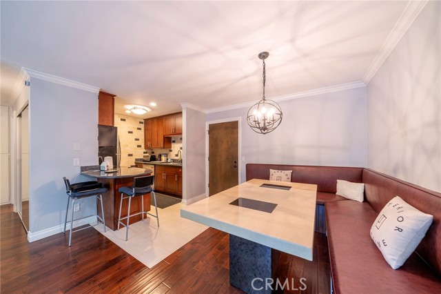 Kitchen with breakfast counter to built in dining area