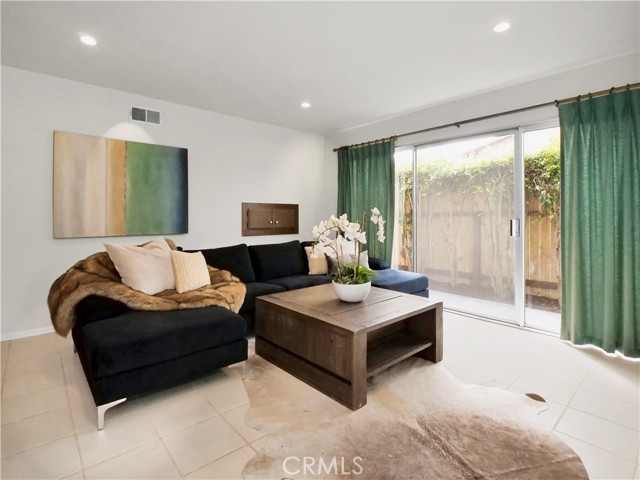 View of the family room with sliding door to the side yard.