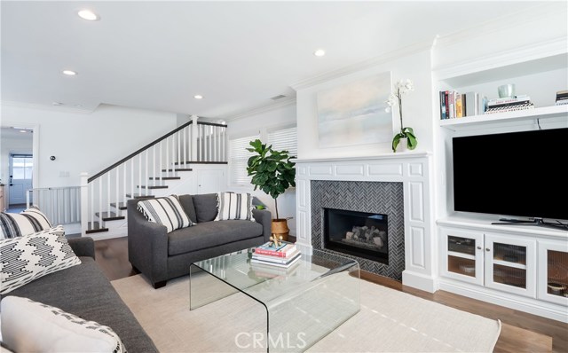 2030 Prospect Avenue Hermosa Beach, California Rare, warm, contemporary remodeled home located on a corner lot with amazing ocean view roof deck. A privacy hedge & new white fence greets you as you walk through the child friendly front yard. Open the door to this happy & graceful 3 bed, 3 bath home w/ ~ 2000 sq ft. Custom floors & A+ upgrades (AC!) are part of the “WOW” factor! The living room features an inviting window seat, a refaced fireplace & a wall of large windows for amazing natural light. The dining area focal point is a large drop down pendant hovering over a farm table. The kitchen w/ all newer appliances has a huge walk in pantry, breakfast bar & opens to a new custom-built office/study space, w/ a Dutch door to a back patio, w/ grill & built-in casual bench seating. One bed & remodeled bath are on the lower level. Upstairs features a large master suite w/ vaulted ceilings, window seat, refaced fireplace, walk-in closet & gorgeous remodeled bath, both with ocean peeks. Upstairs laundry room has ample linen storage. The third bedroom is large w/ vaulted ceilings & ocean peek. Another flight up is an amazing roof deck w/ a new glass protective perimeter. Choose the bar stool perch or the built-in couches to photograph your favorite sunset. The detached garage is located on 20th place w/a side storage area. Side street parking & back home entrance are key on this corner lot. This family friendly neighborhood is a few blocks to schools, parks, dining, shopping & only a 10 min walk to Hermosa Pier.