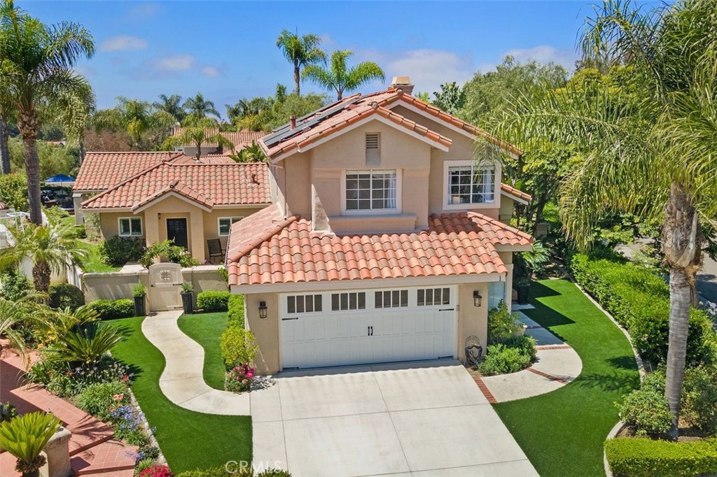 1 Bastia Laguna Niguel, California ACCEPTING BACK UP OFFERS! Incredibly rare opportunity to own TWO homes in enviable Marina Hills! Nestled on one of the largest lots in the highly desired Terracina community, this enchanting property boasts two exquisite dwellings, perfect for those seeking a dreamy retreat, multi-generational living or a lucrative investment opportunity. Poised on a cul-de-sac corner lot, these solar powered, PEX piped homes shine w/ picturesque faux grass, carriage garage door & a grand double door entrance to the main home or delightful path to the Casita. Cathedral ceilings soar above freshly painted walls & warm hardwood floors in the approx. 2,000 sq ft main home featuring 3 beds, 2.5 baths (or easy 4th bedroom conversion). Natural light streams in from an abundance of windows bouncing off the double-sided fireplace in the living & family rooms which open to the gorgeous kitchen remodeled in pristine white shaker cabinets & sparkling quartz counters. Upstairs, the extremely private 2 room primary suite is crowned w/ cathedral ceilings that flow to your primary bath, remodeled in luxurious Carrera marble & custom-built closets. Two secondary rooms & full-bath complete upstairs. Outside, delight in a vast, private entertainer's dream backyard enhanced w/ a lighted gazebo, lush grass, mature trees, romantic rose arch & ample space to design your pool paradise. An oversized 2.5 car garage adds to the property’s abundant storage. The term "Casita” hardly does justice to the nearly 1,100 sq ft full-size 1 bed, 1 bath home just built in 2019. A gated arch opens to a generous front yard. Inside tall ceilings & an open-concept design beckon you into the exquisite living & dining areas, seamlessly integrating w/ the breathtaking kitchen in which slate countertops beautifully contrast elegant white shaker cabinetry, stainless steel appliances & walk-in pantry. The large primary suite & sitting area (room for 2nd bedroom) & striking barn door open to the primary bath complete w/ oversized shower, adorned floor-to-ceiling in gray tile nestled near your custom walk-in closet & laundry room. Outback a private sanctuary awaits. Surrounded by verdant landscaping, the wraparound yard hosts a deck, storage shed & space for more. No Mello Roos, low HOA, amazing resort style amenities. Near beloved hiking/biking trails & the beach less than 5 miles away. The epitome of luxury living w/ incredible investment potential - seize this rare opportunity before it slips away!