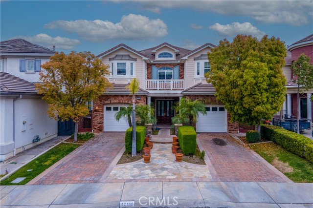 When it comes to Real Estate, most people say, it's all about LOCATION. This Home's ideal location, enormous space, distinctly appointed living and seating areas, topped with picturesque views ranks high on Homebuyers list. Discover Vista Del Verde in Yorba Linda! A Master Planned Community of high quality and well-built Homes by Toll Brothers. The commanding double entry, glass accentuated front doors perfectly ties in the delicately curved stairway, punctuated by wrought iron hand rails. Marble tiles alternate with patterned carpeting lay flooring throughout most of the home. Wide open hallways partitioned by columns and arches outline seating areas for formal and casual function, separated and yet functionally inter-connected. Towering ceiling height create the illusion of more space allowing for natural light to permeate throughout the residence. The enormous kitchen is  anchored by a functional island and an expanded counter space with granite countertops. An abundance of cabinets line the walls for storage and organization. All 5 bedrooms have their own bathrooms. A main level bonus room outfitted as an office with built-in desks and shelving can be a 6th bedroom option. 2 separate upstairs loft offers a variety of use. Recessed lighting, crown molding, millwork accent and trim on the ceilings and custom window coverings can also be found. Wired ready for in-home security. 3 fireplaces distributed in the family, living and master bedroom. HVAC system has been recently replaced. Once you step outside into the backyard, the colored poured concrete is enhanced with flagstones. Extensive masonry work is achieved with a space-defining outdoor stone fireplace, a built-in barbecue area and a Roman-inspired wall fountain, gracefully placed at the center of the space. Enviable views from the Master Bedroom balcony with almost nightly fireworks is a sure delight. This perfectly imperfect House awaits a future homeowner to repair, remodel, rejuvenate and restore it back to its glorious beauty and grandeur. There is NO monthly HOA dues and NO Mello roos. This home attends the best schools in the area. With expanded streets, verdant grounds and meandering walking & hiking trails, a nearby golf course, and a highly ranked city for best places to live, give this home a serious consideration.