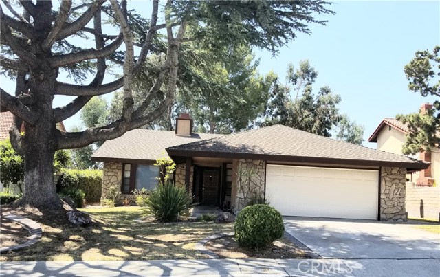 1609 Oxford Court West Covina, California Beautifully Upgraded 3 Bedroom 2 Bathroom home. Imagine coming home, and relaxing, with a glass of wine after a days work or the weekend as you take in overlooking the Valley, Beautiful viewa of the mountains and city twinkling lights. Upon entering you will find a large open Floor Plan with high ceilings, the Family room features a slump stone fireplace. A beautiful Kitchen with reset lighting and crown molding. The kitchen features an eating Bar, semi-new built-in oven, brand new cook top, and venting fan with stainless finishes. The Family Room features also high ceiling with a glass slider to view the valley twinkling lights below. Porcelain tile throughout the family room, kitchen, hallway and baths. This home has brand new gorgeous the modern-day laminate flooring in all bedrooms, the livingroom, and the dining room. Did I say all the bedrooms too! The large Master bedroom features mirrored wardrobe doors with custom closets. The Master bath is adorned with beautiful Dual Granite vanity sinks, gorgeous Travitine large shower. The hall bath is new with modern hew-colors. This home is fully lanscaped with automatic sprinkler system and timer, double insulated two-Car Garage door with automatic opener. Enjoy this one of a kind resort style luxury home, shopping close by and much more! This home has Central AC and heating.