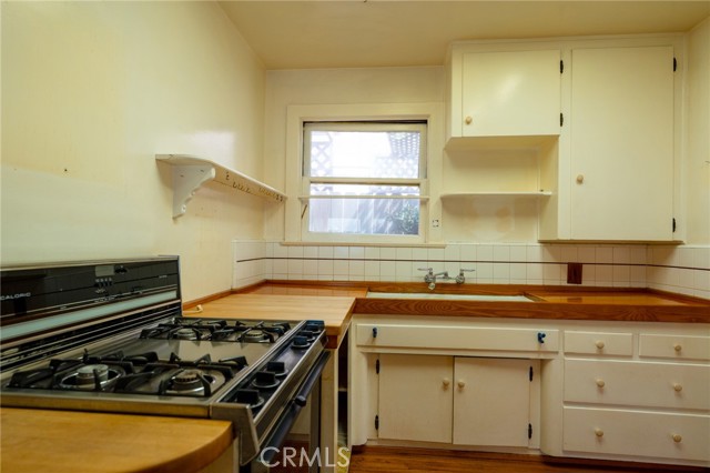 The Kitchen Counter Includes a Large Built-in Butcher Block The Kitchen Counter Includes a Large Built-in Butcher Block