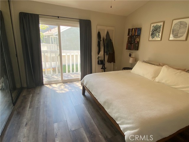 Large master bedroom with balcony