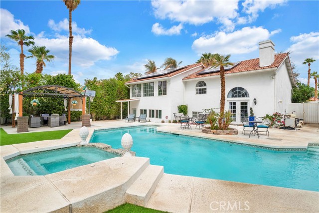 68725 Minerva Road Cathedral City, California HUGE PRICE ADJUSTMENT!!! This gorgeous 3 bedroom, 4 bath Cathedral City home is luxuriously appointed with high end finishes and is being sold with all furnishings included! Situated on Minerva Rd, which is well known as Candy Cane Lane for its enthusiastic Christmas decorations during the holidays, you'll be blown away by the incredible curb appeal of the house with its beautiful mature landscaping, tile roof and 2 car garage. Enter the home to find yourself in a massive open concept living area with vaulted ceilings, impressive chandeliers, and huge arched windows. In the dining space, French doors beckon you to explore the outdoor living space. Take a moment to step outside to be blown away by the private outdoor oasis this property possesses. An extensive concrete patio surrounds the luxuriant pool and spa, while a built in BBQ and bar, sitting areas, and outdoor TV with fire feature and a second firepit are surrounded by faux grass and lush mature landscaping. Moving back inside, you'll note the home has a neat split floorplan; stepping down to the lower level, you'll encounter a spacious kitchen with stainless steel appliances (including gas stove and range hood!), tons of lovely cabinetry, and a beautiful tile backsplash that stretches all the way to the ceiling! The convenient powder room features a stylish vanity and mirrored wall. You'll find the first bedroom here on the lower level, which is nicely sized with a big closet and also has its own attached sitting room with backyard access. You'll love knowing that all the bedrooms in the home have their own private bathroom this one has a nice tub/shower combo. The other bedrooms are on the upper level, accessed by cool floating stairs with glass railing. The second bedroom has large arched windows with killer views of the backyard and the mountains, while its attached bathroom features a walk-in rain shower with sleek black marble and glass. Last but not least, the expansive primary bedroom which offers two huge closets, more big windows with great views, and a large primary bath with dual sinks and an epic-sized walk-in tiled shower with a sitting bench and view of the pool! Come see this incredible home for yourself, book a showing today! Again this home is being sold FULLY FURNISHED! ********