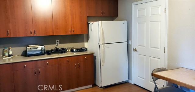 Kitchen with refrigerator
