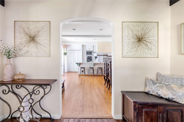 Arched doorway of front entry leads to family room/eat-in kitchen.