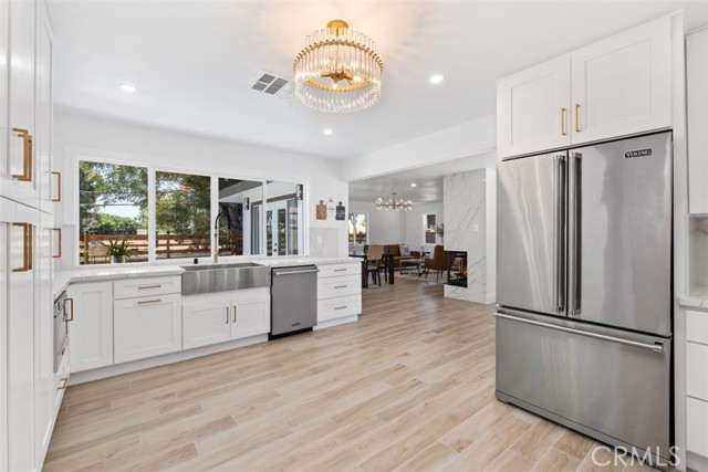 High-end soft-closing cabinetry with gold accents