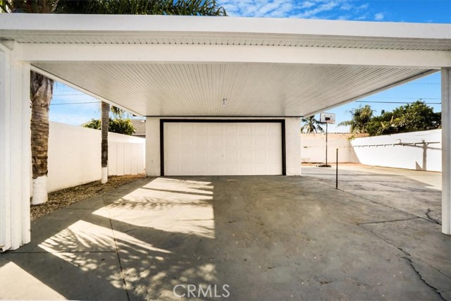 Carport leading to converted garage