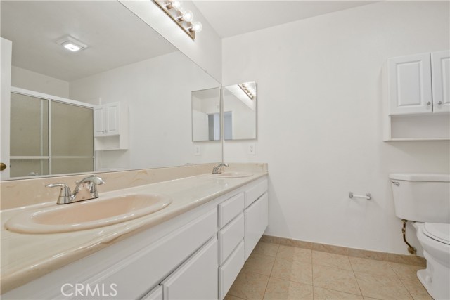 Center Hall  bathroom with ceramic tile flooring and walk-in shower