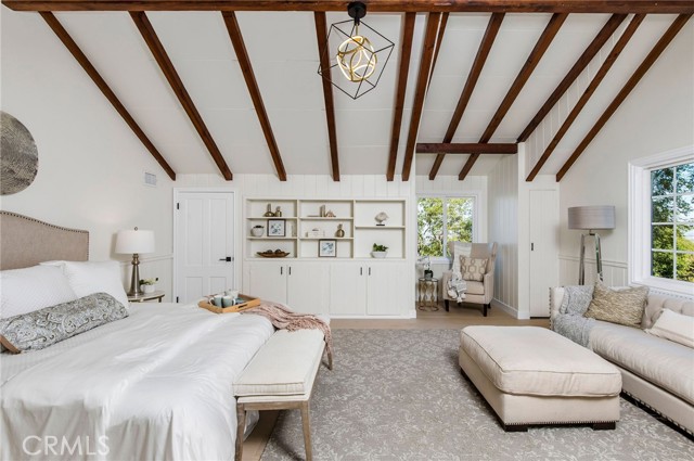 Primary bedroom with valuted ceilings.