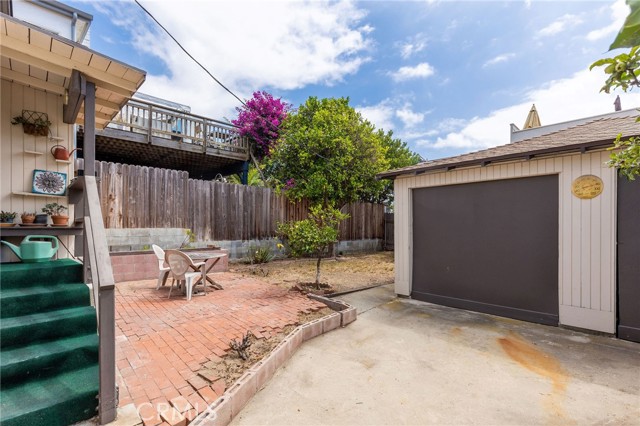 Garage and yard and back staircase from kitchen.