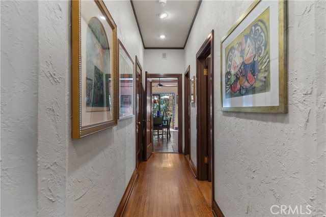 Hallway looking into kitchen and backyard