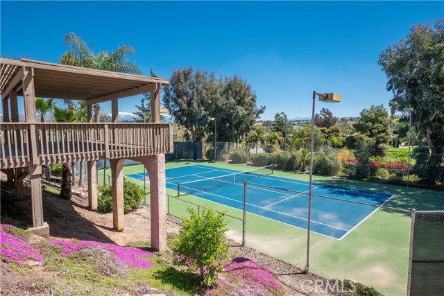 Wooden deck overlooking the tennis court