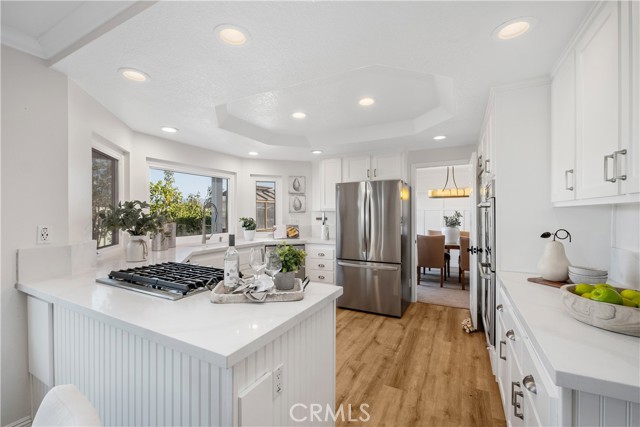 Gorgeous white and bright kitchen with Quartz counters and upgraded appliances!