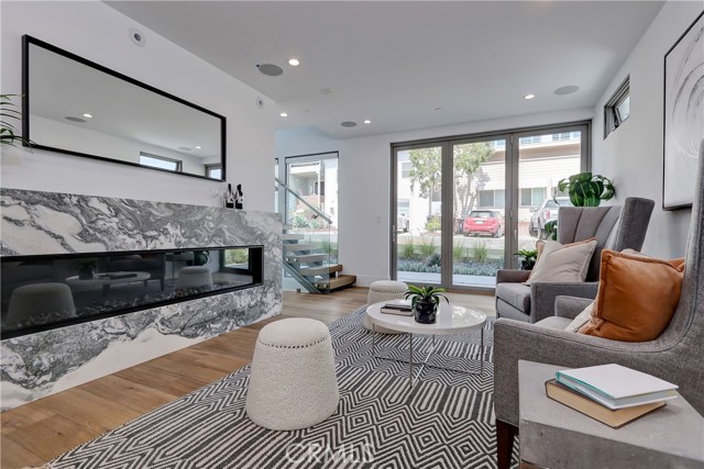 Ground level beach room with 80' linear fireplace