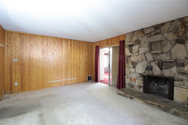 The front living room has a fireplace with a large hearth.