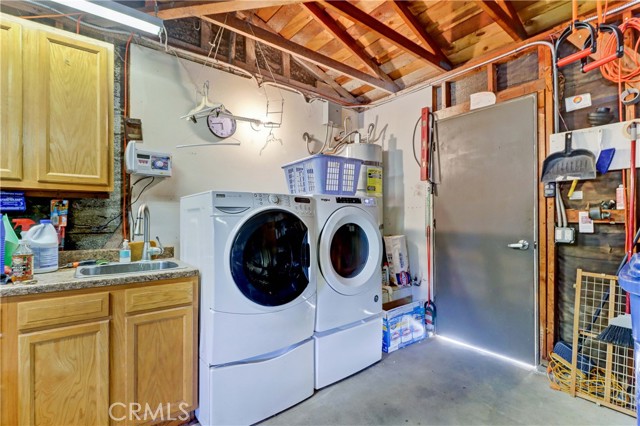 Garage: Sink & cabinet near Washer/Dryer with the Sprinkler Sytem controls above, Water Filter Sytem (not in picture)