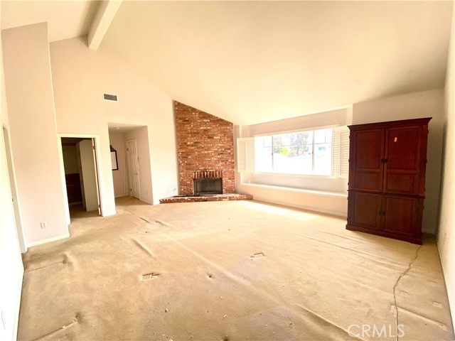 Massive, lofted Primary Bedroom with romantic fireplace.