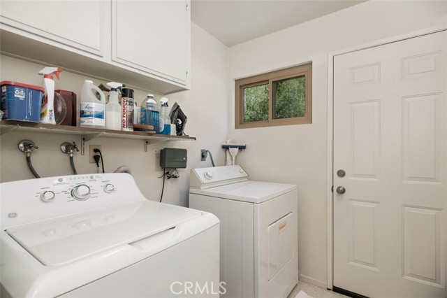 Full Laundry room off kitchen hallway.