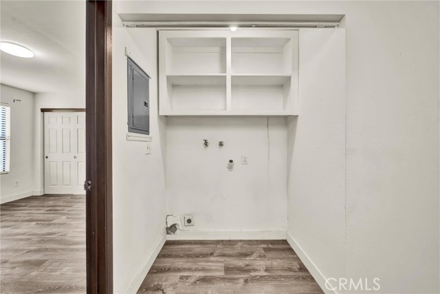 Laundry alcove in hallway.