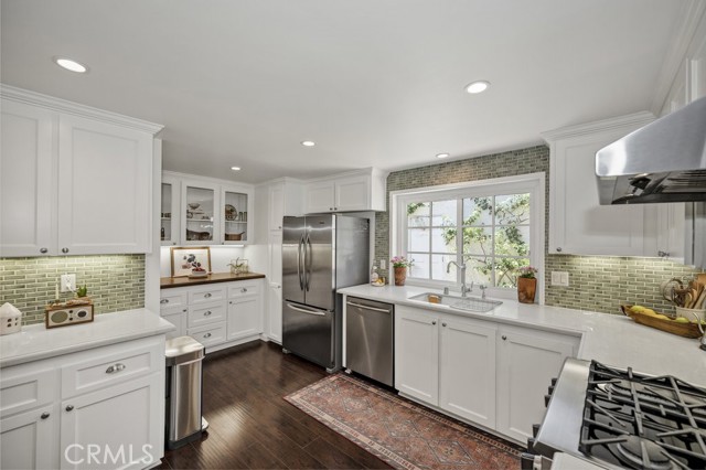 Custom designed kitchen with high-end appliances and finishes.