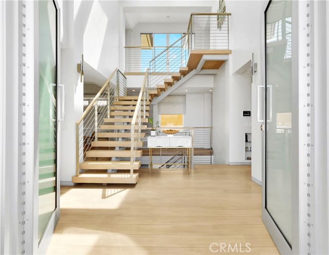 Light and bright 2 story entryway.