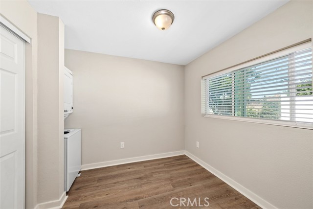 Bedroom with closet organizer and stackable W&D!