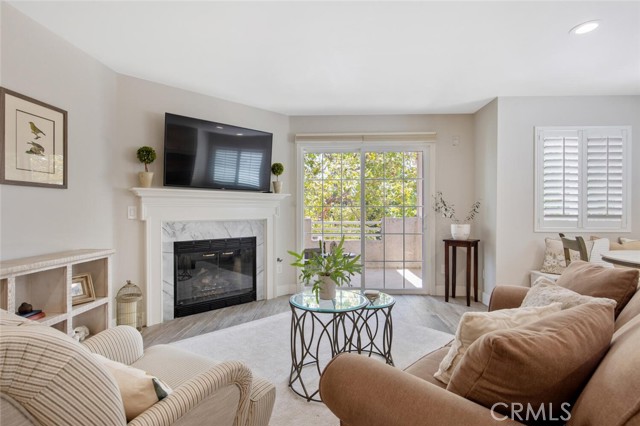 living room with updated gas fireplace