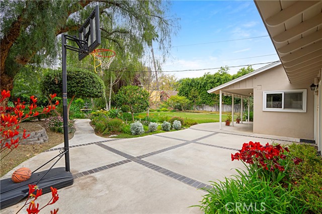 There is also a custom concrete patio, great for games of basketball with the kids.