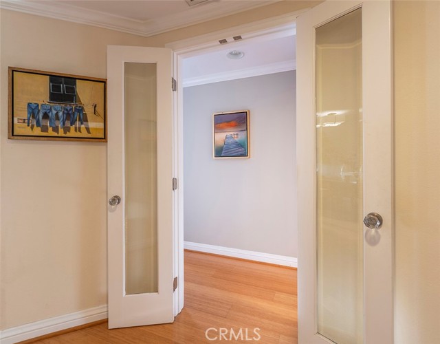 Glass French door entry to Primary Ensuite