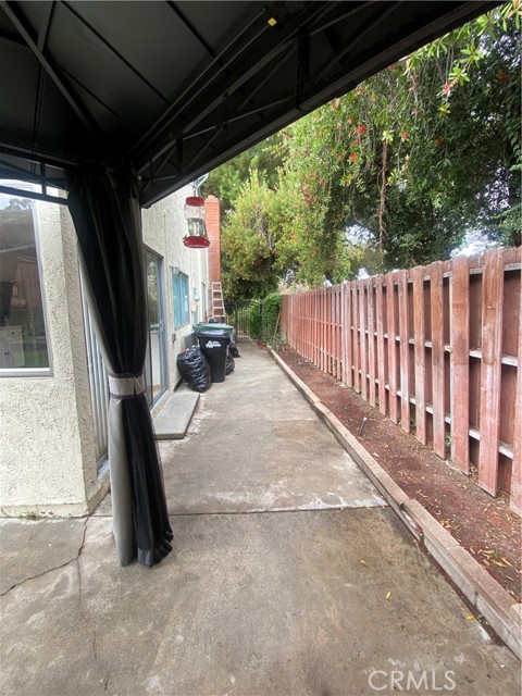 View of side yard (gazebo does not stay).