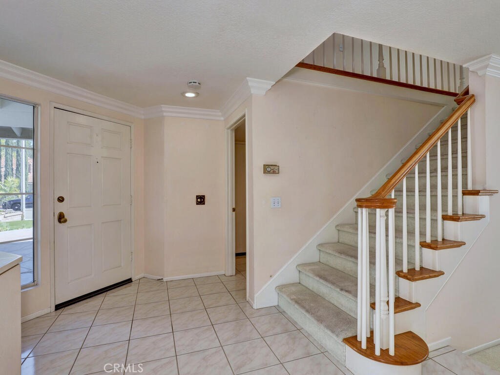 Entry, stairway and laundry room to garage