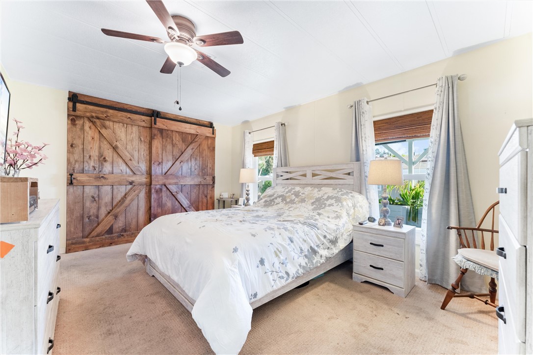 master bed with custom sliding barn doors